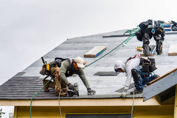 Professional Storm Damage Roof Repair technician working in Hyde Park, NY
